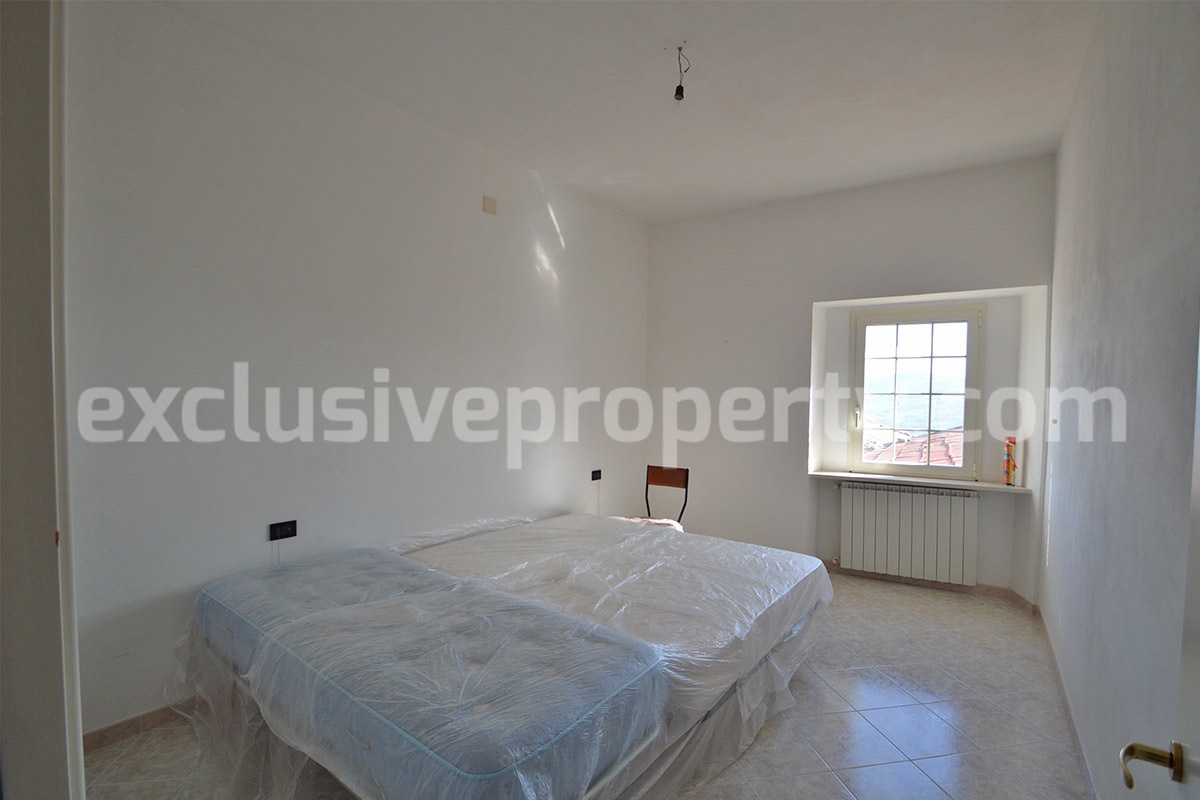 Stone Apartment for Sale in Abruzzo - Renovated Home with Balcony - Views and Historic Marble Portal