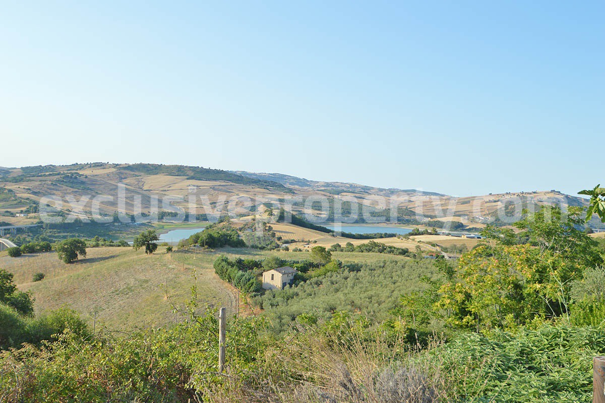 Renovated Stone House for Sale in Italy - Terrace and 5 Hectares of Land with Lake View in Casacalenda - Molise
