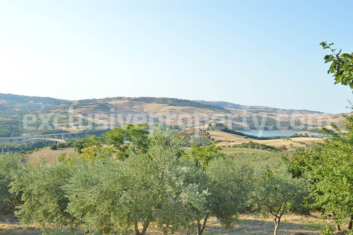 Renovated Stone House for Sale in Italy - Terrace and 5 Hectares of Land with Lake View in Casacalenda - Molise