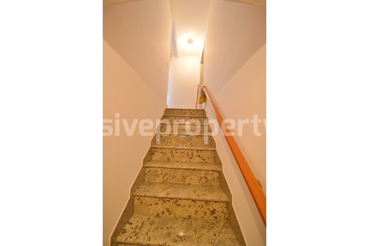 Cozy Stone Townhouse for Sale in Castelguidone in Abruzzo - Move-In Ready with Thermo-Fireplace
