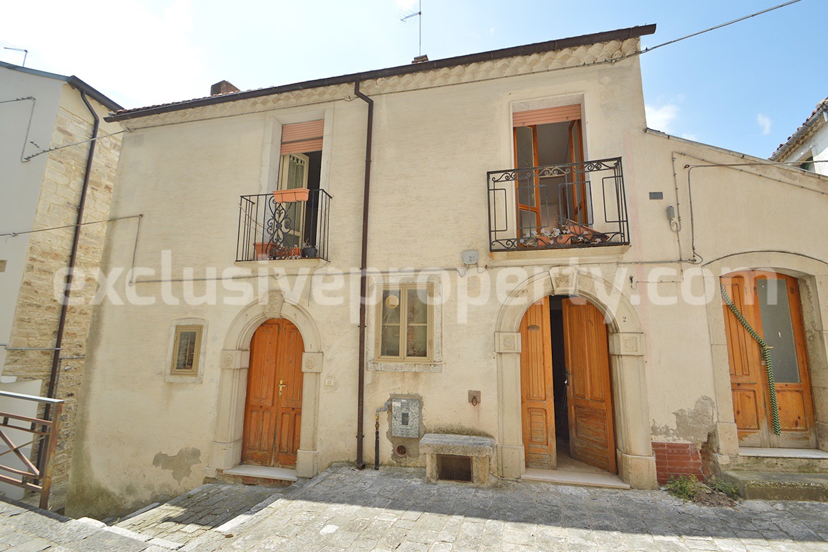 Renovated Historic House with Original Stone Features Balconies and Vaulted Cellars for Sale in Italy