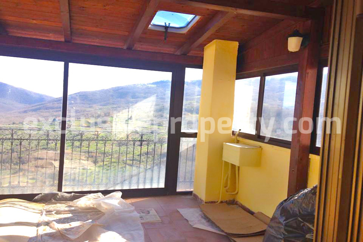 Property with wooden veranda with panoramic views over the valley