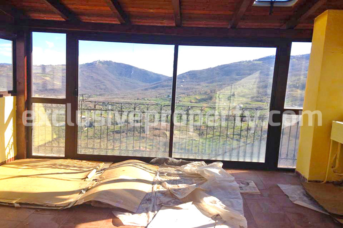 Property with wooden veranda with panoramic views over the valley