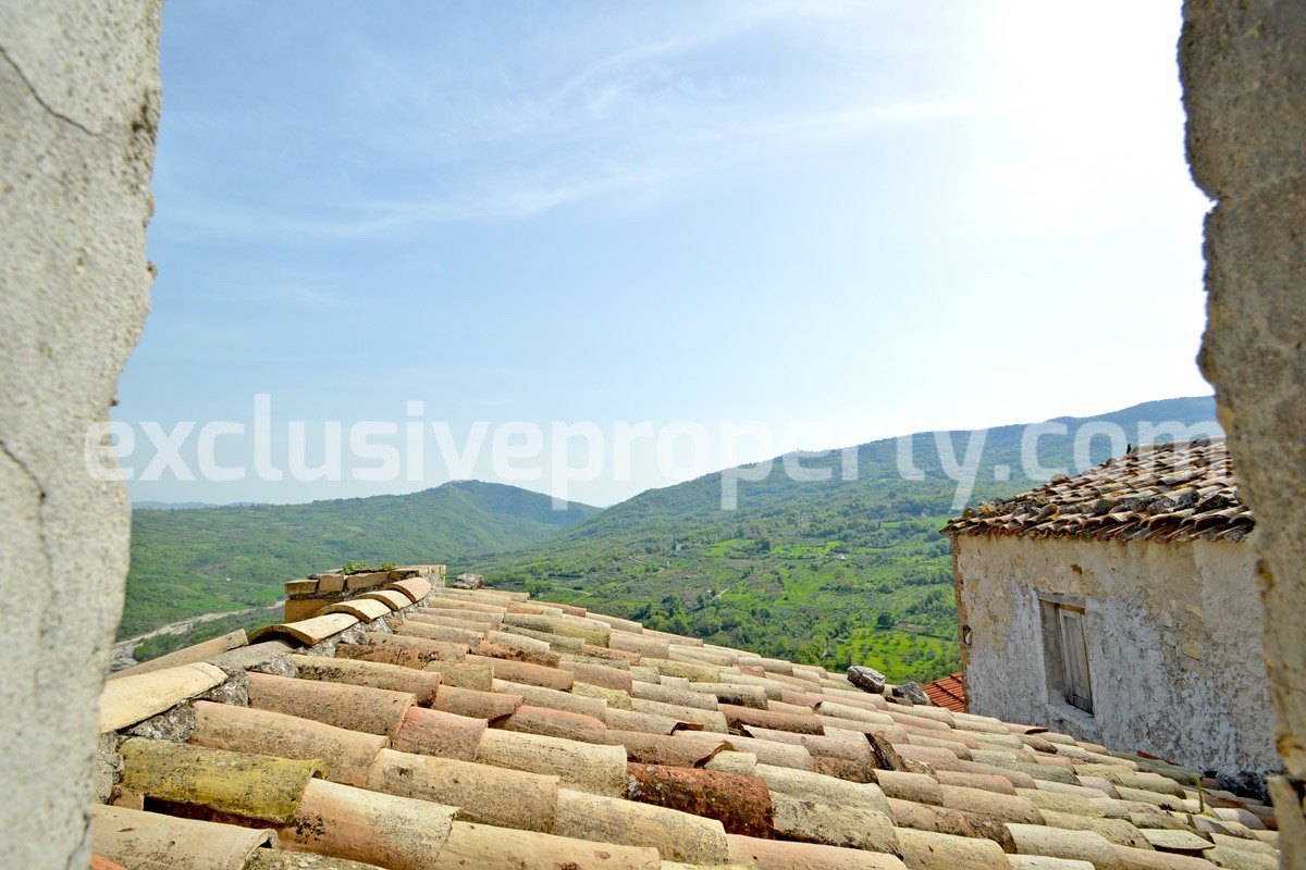 Historic house of stone with an ancient door with a panoramic view 10
