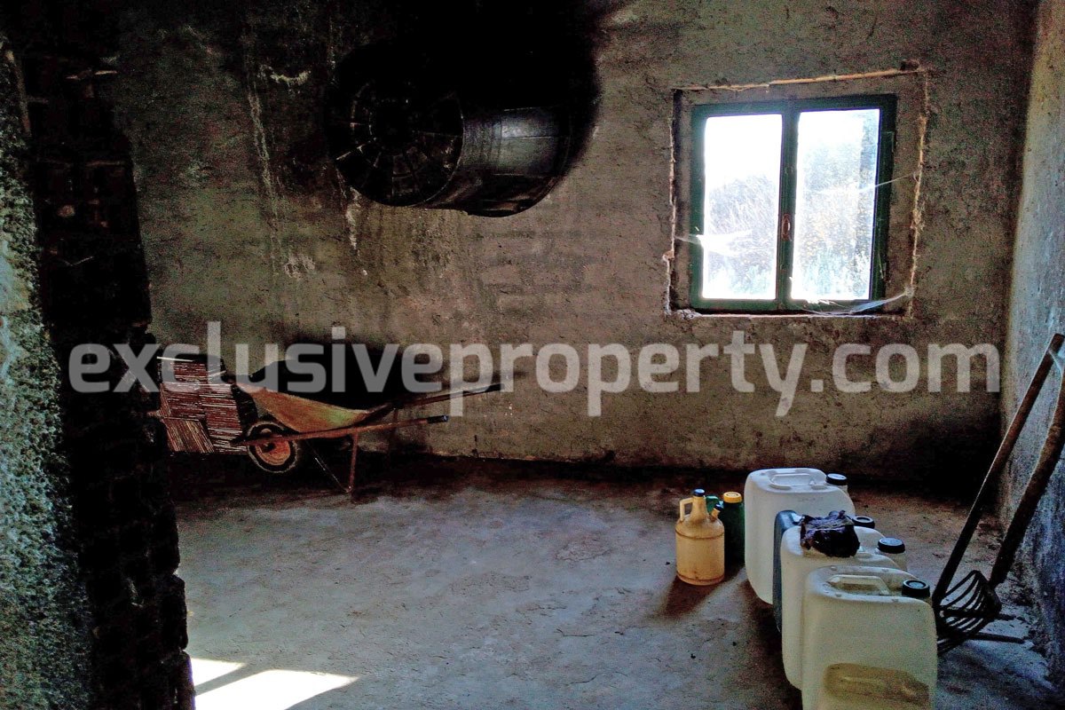 Brick farmhouse surrounded by nature with well for sale in Italy 12